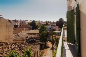 a view from a balcony of a village with roofs at Case d ' oro in Lefkímmi