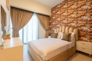 a bedroom with a large bed with a brick wall at INA Homes - Act 1 Full Burj Khalifa and Fountain Views in Dubai +11 photos