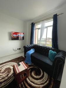 Posezení v ubytování Omuts one bed airbnb with swimmingpool