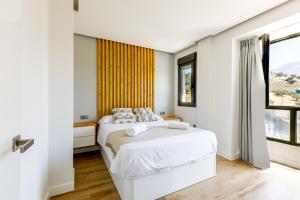 Posteľ alebo postele v izbe v ubytovaní A&N Viñuela Luxury centro