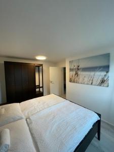Postel nebo postele na pokoji v ubytování xiApartment