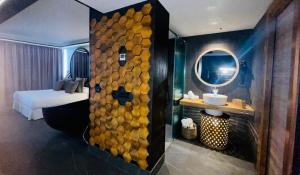 A bed or beds in a room at Poem Apartments, Las Canteras
