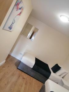 a room with a bed in the corner of a room at Tara View Apartments in Garristown