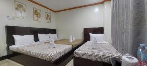Postel nebo postele na pokoji v ubytování ISLAND VIEW SUITES