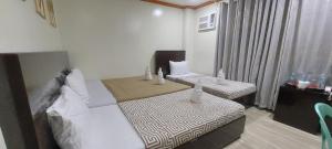 Postel nebo postele na pokoji v ubytování ISLAND VIEW SUITES