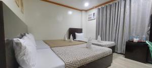 Postel nebo postele na pokoji v ubytování ISLAND VIEW SUITES
