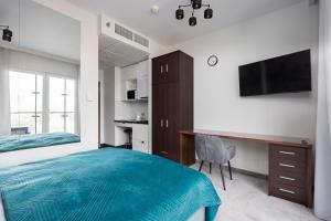 Un pat sau paturi într-o cameră la New Varsovia Comfort 546