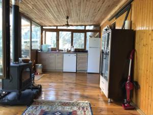 a kitchen with a woodburning stove in a room at Tiny House Village in İznik