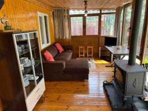 a living room with a couch and a table at Tiny House Village in İznik