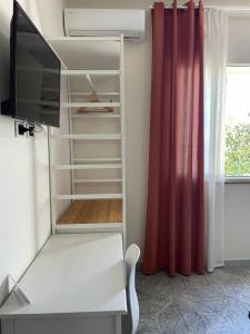 Televízia a/alebo spoločenská miestnosť v ubytovaní A Casa di Giù B&B