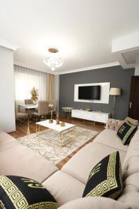 TV a/nebo společenská místnost v ubytování Golden Homes