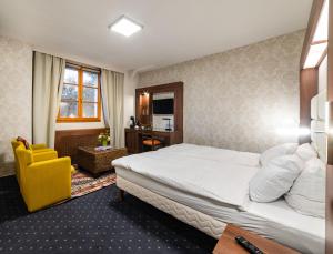 Postel nebo postele na pokoji v ubytování Hotel Restaurant Kutchi + 25 fotografií