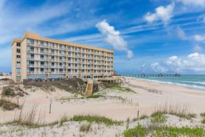 a hotel on the beach next to the beach at Comfort Inn South Oceanfront in Nags Head