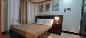 Postel nebo postele na pokoji v ubytování ISLAND VIEW SUITES