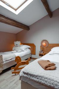 Postel nebo postele na pokoji v ubytování Hôtel Le Pré Galoffre