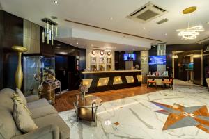 a living room with a couch and a table at City Palace Hotel in Dubai