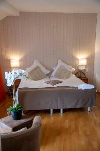 Postel nebo postele na pokoji v ubytování Hotel de la Place