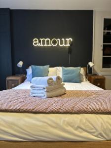 a teddy bear sitting on top of a bed at Unique Clifton apartment on historic crescent in Bristol +22 photos