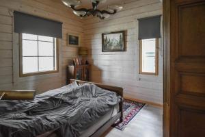 Un pat sau paturi într-o cameră la Villa Classic