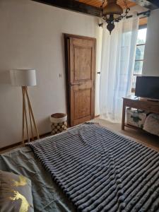 Rúm í herbergi á Gîte d'Aigoual