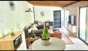 a living room with a couch and a table at Casita Sarabia in Ponteareas