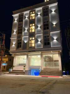 a building with lights on top of it at night at JESTA RESIDENCY in Hassan