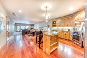 a kitchen with wooden cabinets and a table with chairs at #101 Grand Lodge South Master Suite in Government Camp