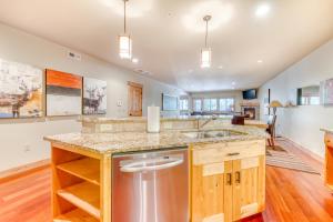 a kitchen with a sink and a counter top at #101 Grand Lodge South Master Suite in Government Camp