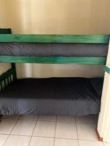 two bunk beds in a room at Pendleberry Holiday Resort - Unit 41 in Bela-Bela