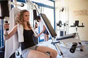 Hotel Comfort Erica Dolomiti Val d'Adige tesisinde fitness merkezi ve/veya fitness olanakları