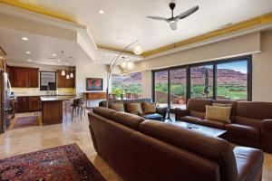 a large living room with a couch and a kitchen at Red Rock Escape with Suite in St. George