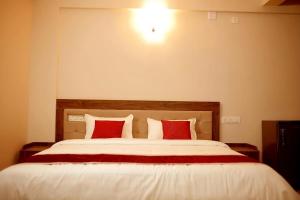 Oryx Home The Business Class Hotel客房内的一张或多张床位