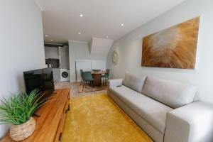 a living room with a couch and a table at SWEET home I in Caniçal