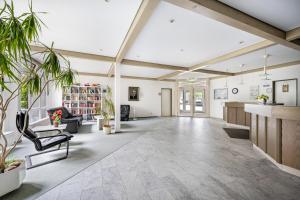 an office with a large room with a large ceiling at Apartement Bublitz in Travemünde