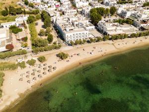 an aerial view of a beach with people in the water at Play Paros in Kampos Paros