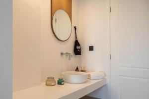 a bathroom with a sink and a mirror on the wall at Play Paros in Kampos Paros