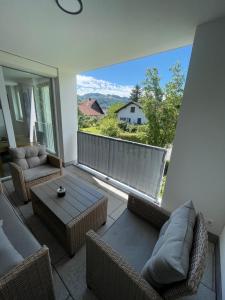 a living room with a view of a balcony at xiApartment in Höchst