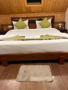 Postel nebo postele na pokoji v ubytování Hotel Sonar Bangla Taki