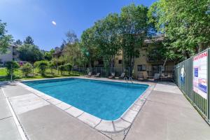 a swimming pool in front of a building at #552 Cozy, Mountain View Condo with Pool & Spa in Mammoth Lakes