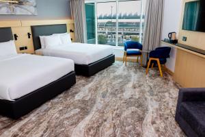 Postel nebo postele na pokoji v ubytování Holiday Inn Express Dubai Airport by IHG