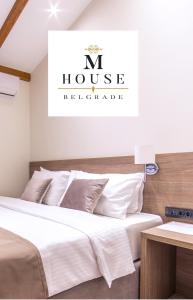 a bedroom with two beds and a n house residence at M House B&B in Belgrade