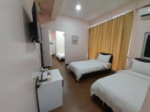 TV a/nebo společenská místnost v ubytování Sipadan Crystal Haven Inn
