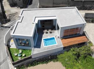 an aerial view of a house with a swimming pool at Pohang Poolvilla Dearmood in Pohang