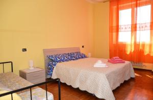 Postel nebo postele na pokoji v ubytování Casa Vacanza M.V.