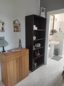 a bathroom with a black cabinet and a sink at Buongiorno Majella - Appartamento con piscina in Lanciano