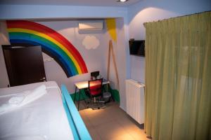 a bedroom with a rainbow painted on the wall at Psm Luxury Living in Kánithos