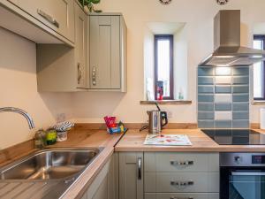 a kitchen with a sink and a counter top at Harebell Hill Jericho Farm in Earl Sterndale