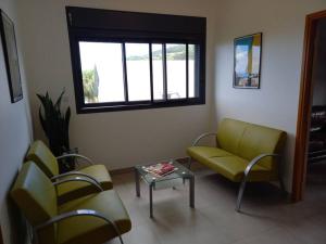 Posezení v ubytování Haut de villa avec piscine