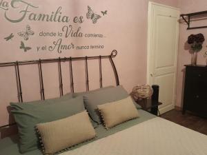 a bedroom with a bed with butterflies on the wall at Casita Esperanza in Copparo