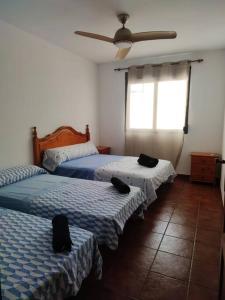 Postelja oz. postelje v sobi nastanitve Gran Casa Rural en Benissa